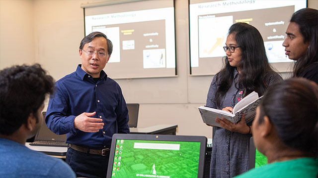 Professor speaking to students